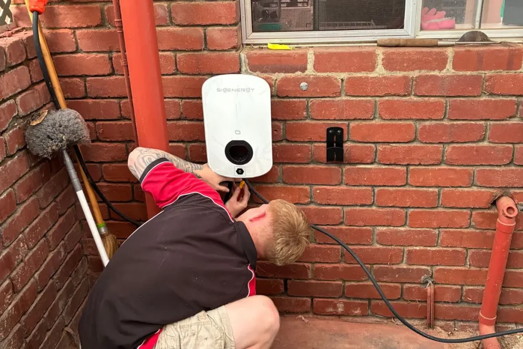 Electrician installing a Sigenergy home EV charger in Seville Grove for safe everyday charging